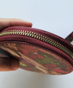 Magenta bird print leather purse for women.