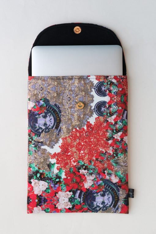 Floral laptop sleeve in red, lilac and mint green.
