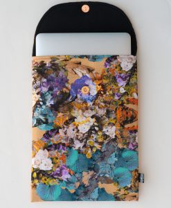 Floral laptop sleeve in beige and blue.